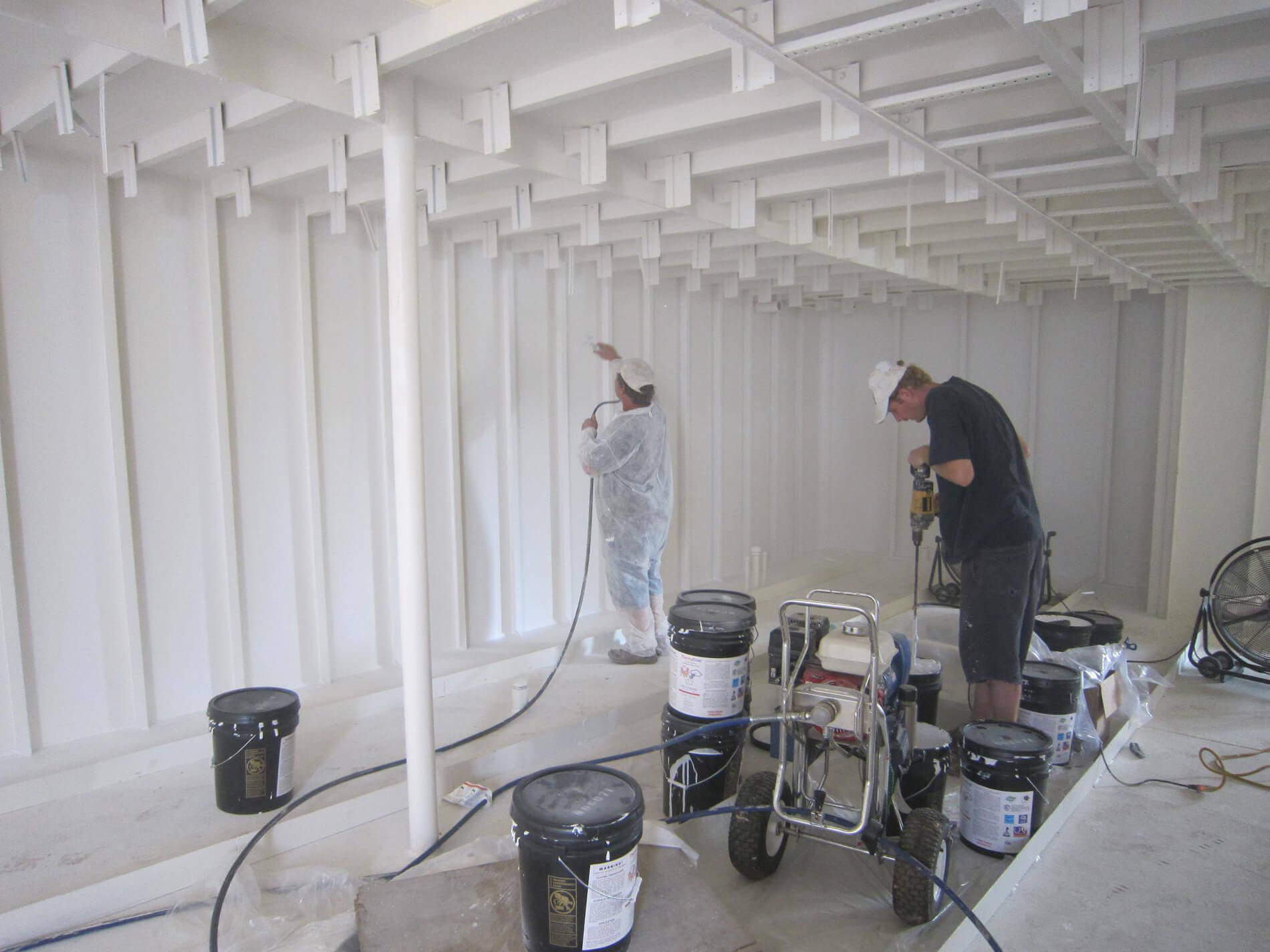 Applying thermaCote to the interior of a ship Applying thermaCote to the interior of a ship